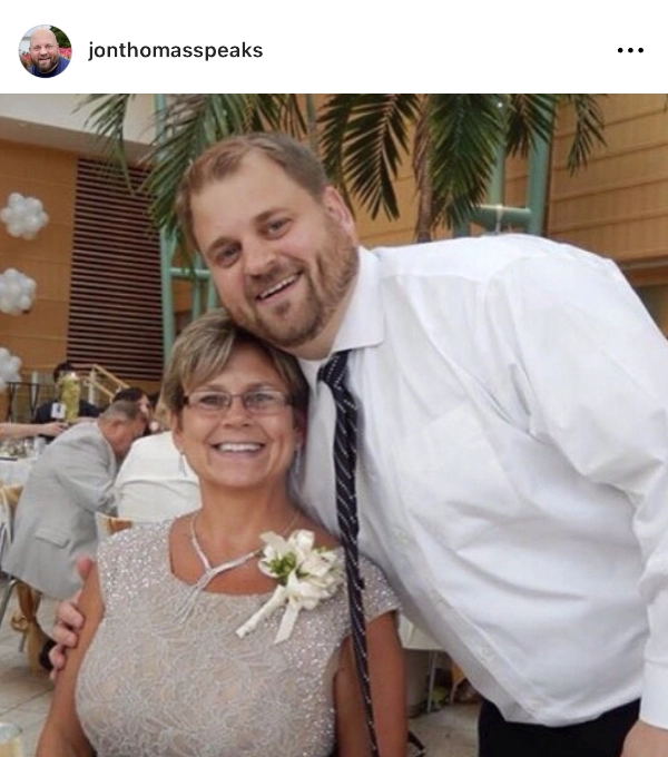 Picture of Jon Thomas at a social event with a woman.